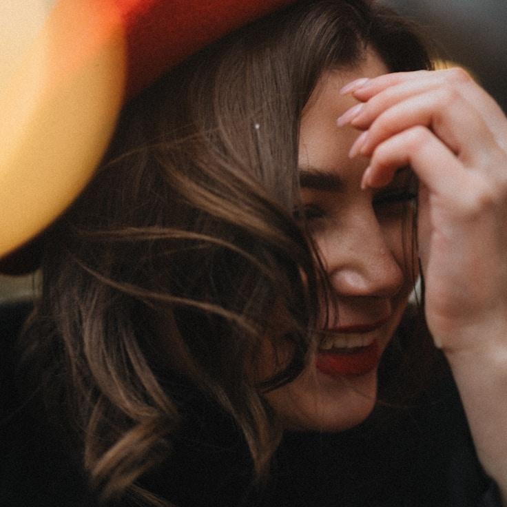 Amina Rao, Lead Design Curator at Gent Letone Vault, reviewing corporate floral arrangements